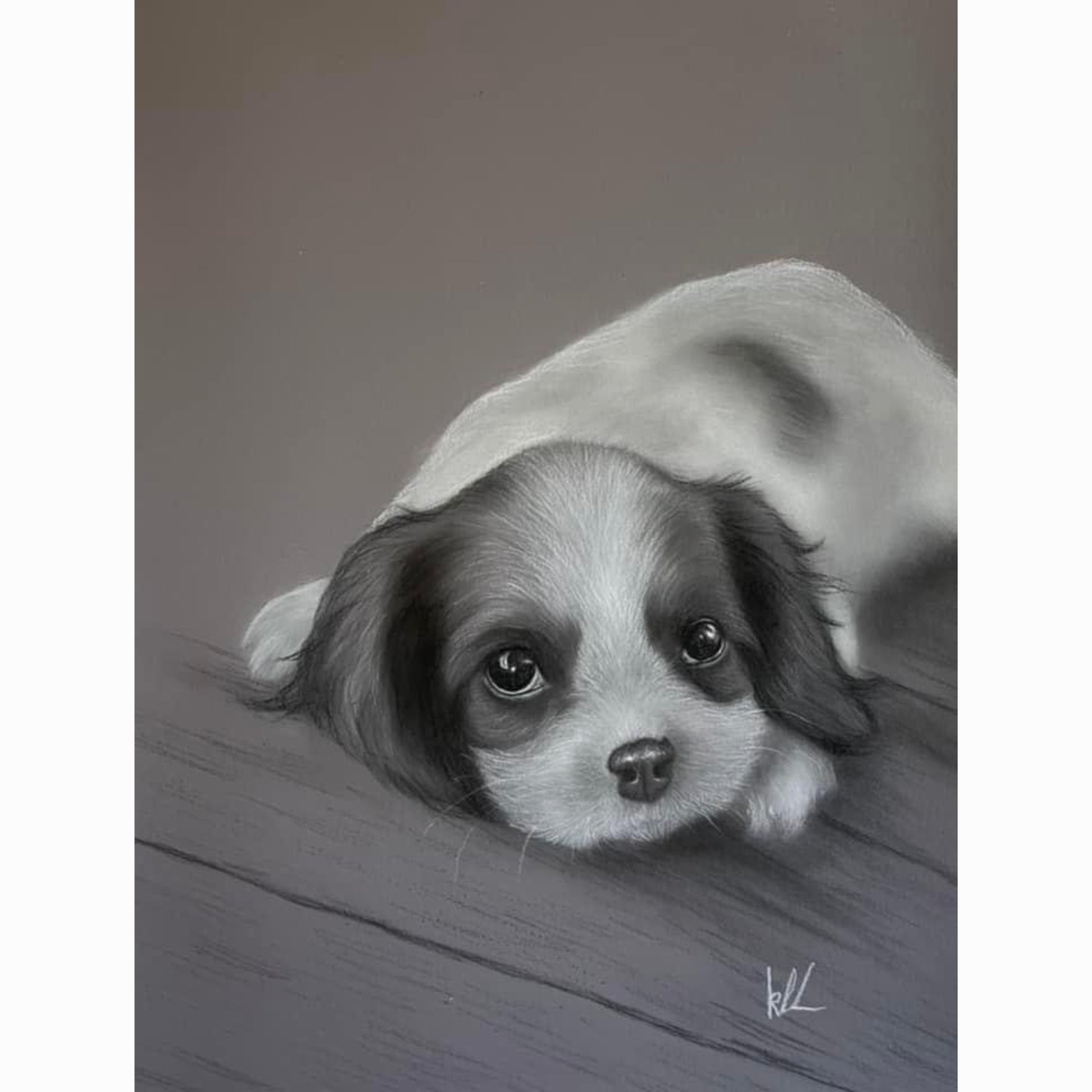 puppy lying on wood floor with eyes open