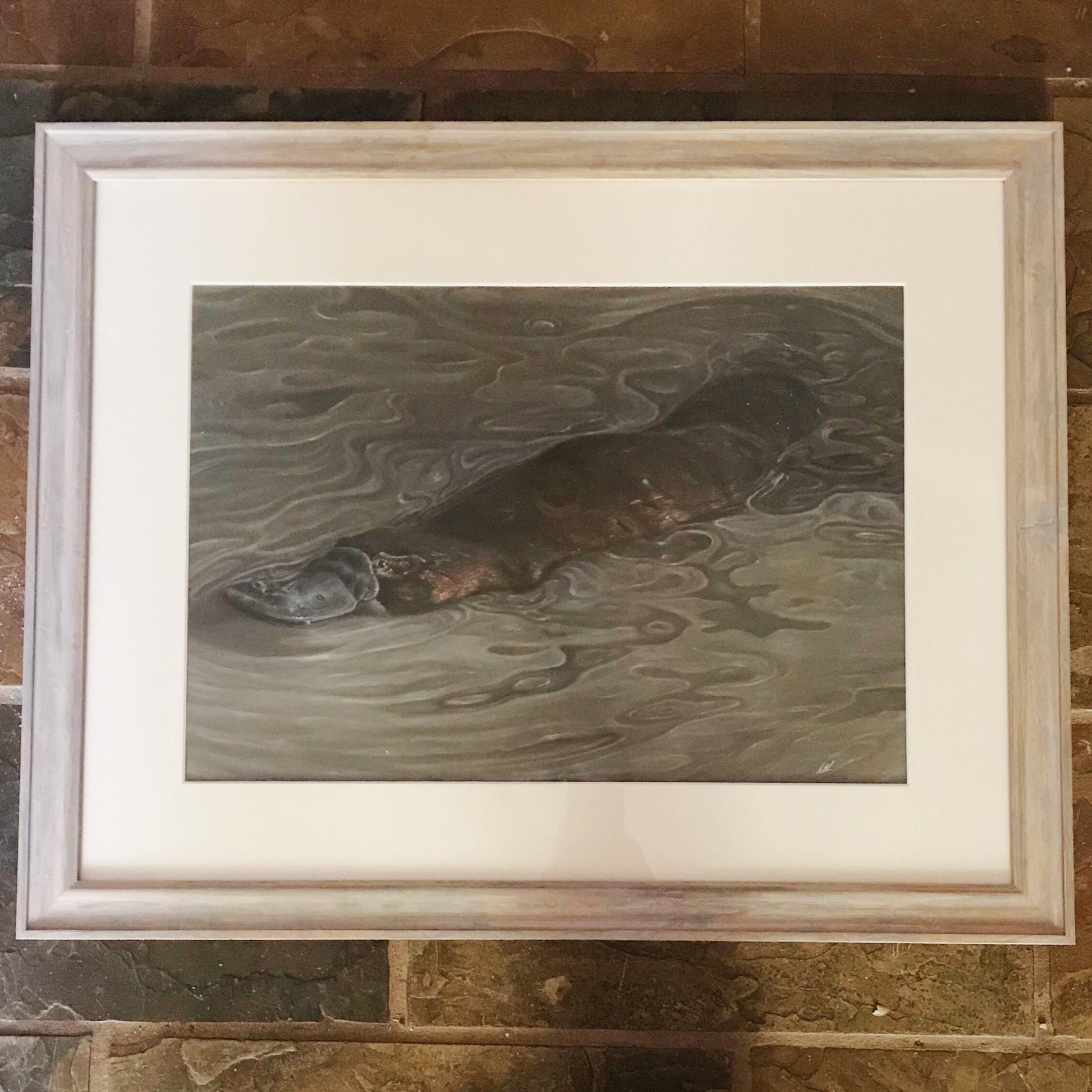 Platypus play original artwork framed on brick wall
