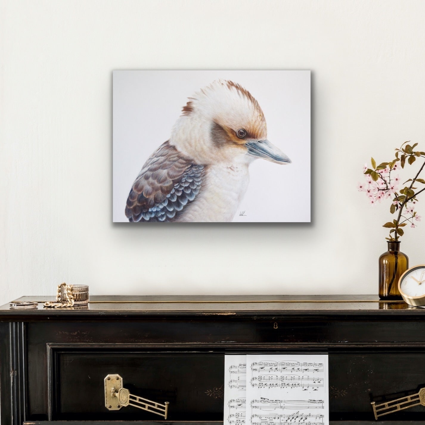 Kookaburra king stretched canvas print hanging on wall over side table